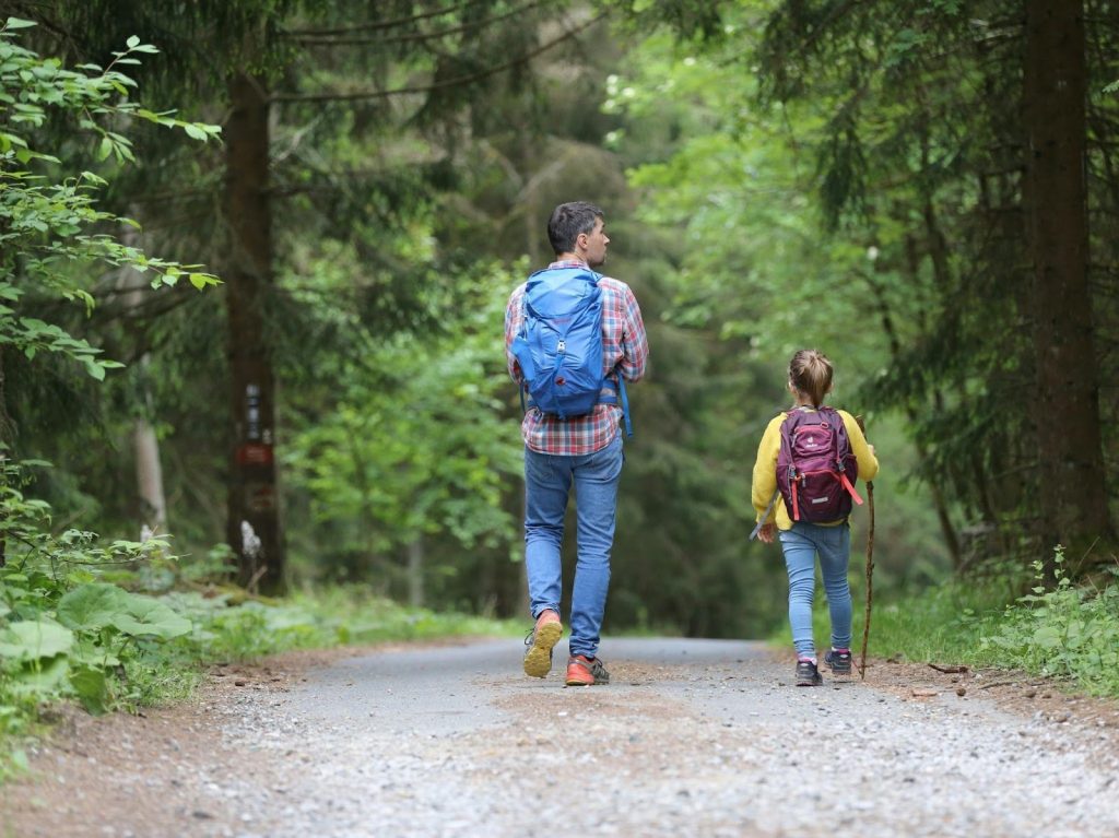Family hiking on a forest trail near Chilliwack homes in the Fraser Valley.